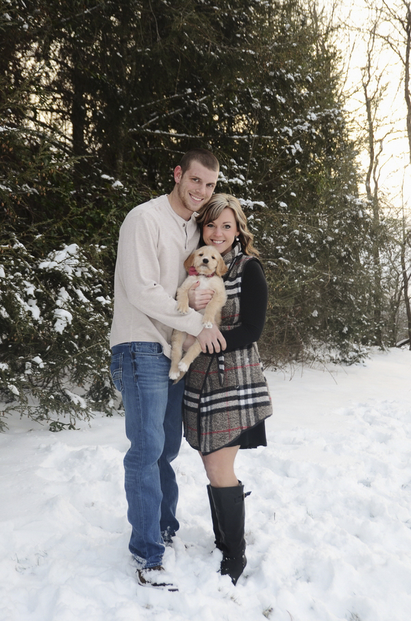 couple with new puppy, winter engagement photos