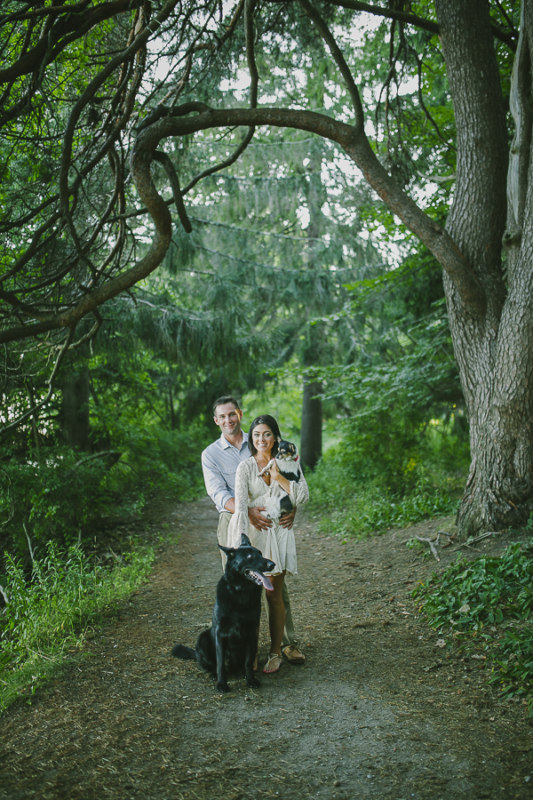 Greta Tucker engagement photos with dogs in woods