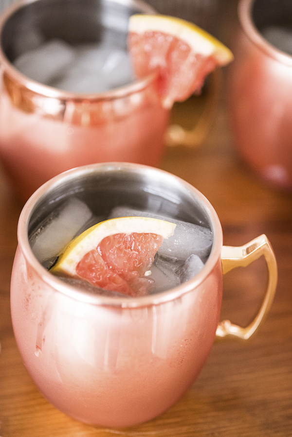 Moscow mule with red grapefruit garnish in copper cups | Puppy Bowl Party Ideas