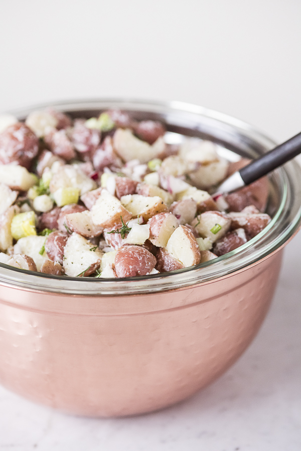vegan potato salad in copper bowl