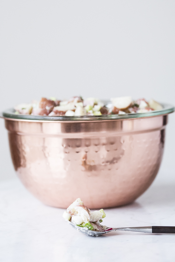 vegan potato salad in copper bowl