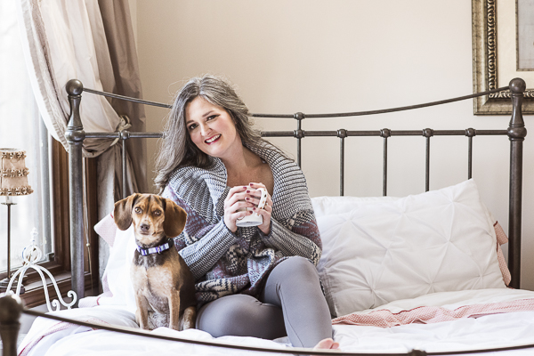 beagle and woman sitting on bed, human-dog bond