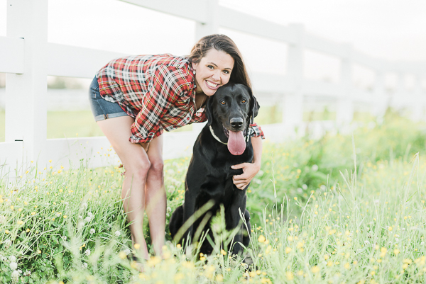 handsome black lab and woman at horse farm, dog and his girl, bffs