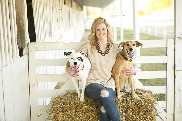woman sitting on hay bale with two dogs, dalmatian mix, hound/lab mix, lifestyle photography