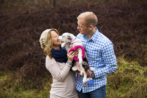 Border Collie puppy licking woman's face, engagement pictures with dog