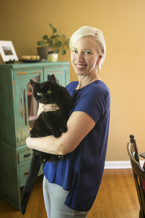 blonde woman holding big black cat, Nashville pet photography
