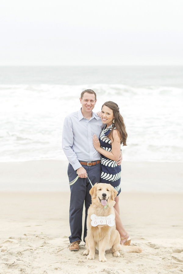 couple on sandy beach with dog, beach engagement photos with puppy, ©Anna Grace Photography 