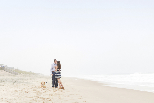 romantic engagement photos at the beach, dog lying in sand at the beach, ©Anna Grace Photography