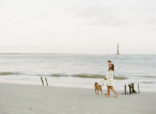 couple walking dog along empty beach, ©Rachel Craig Photography