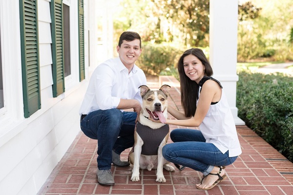 couple with medium sized dog on brick porch, family photos with dog