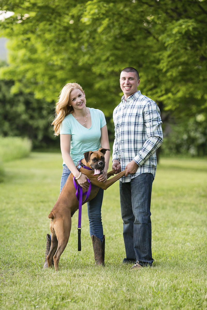 couple with Boxer on hind legs, family portraits ©Moments By Melanie | summer engagement pictures with dog