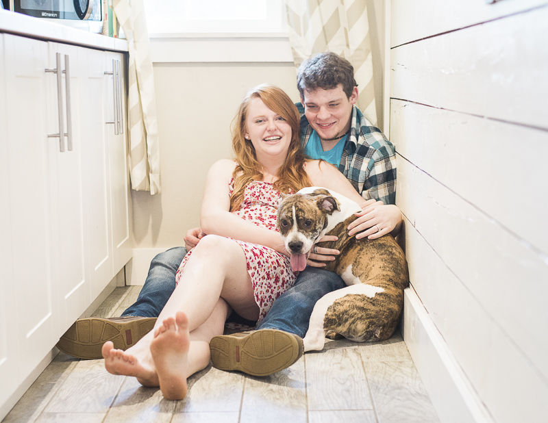 lifestyle portraits in home, couple on kitchen floor with dog