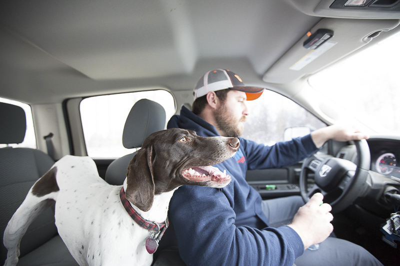 man's best friend, dog and man in vehicle, ©Art By Carly | Sioux Falls dog photography
