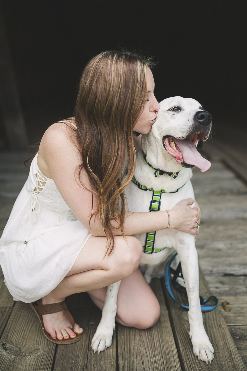 ©Brandy Angel Photography | woman kissing her mixed breed dog