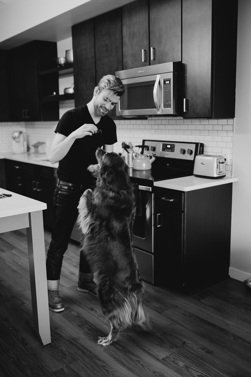 dog standing on hind legs with man in the kitchen ©Empiria Studios | lifestyle dog photography