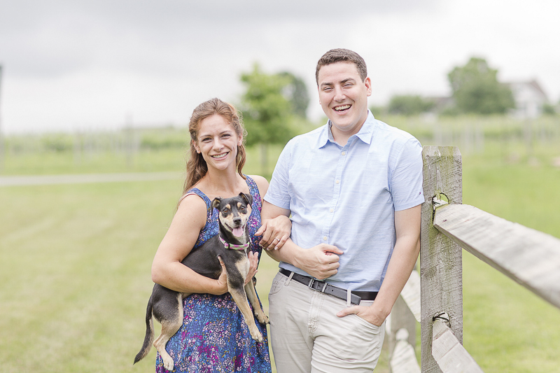 happy couple and their dog at winery, ©Anna Grace Photography | dog friendly engagement pictures