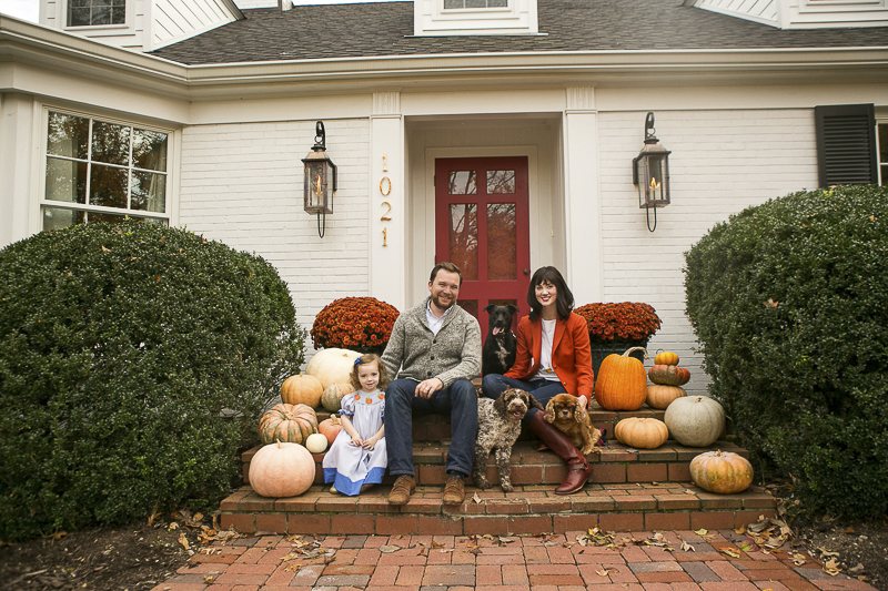 Nashville Fall family portraits, family and their dogs sitting on steps with pumpkins, ©Mandy Whitley Photography