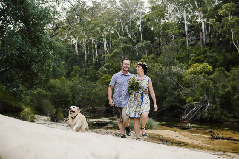 dog running up river bank, engagement photos with dogs in Australia bush, ©Hilary Cam Photography