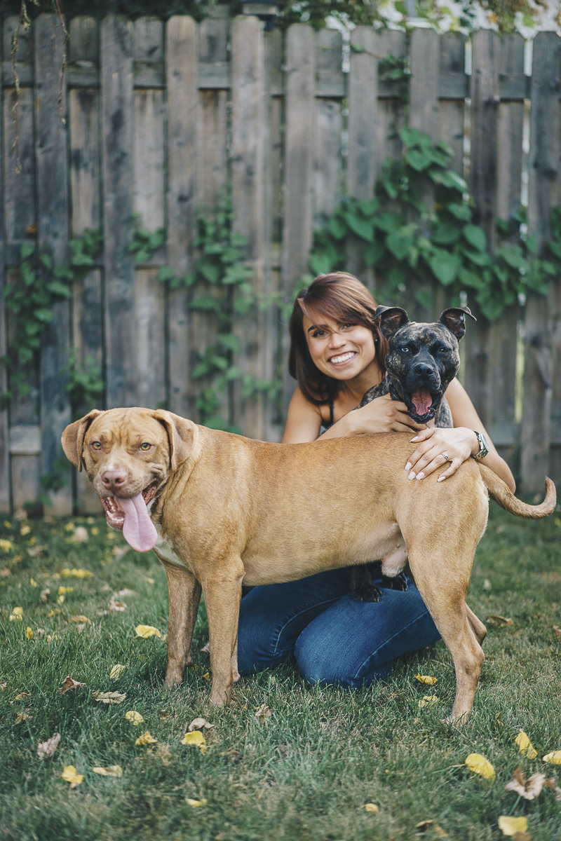woman and her dogs in the yard, lifestyle dog photography, Pit bull advocacy | ©Heck Designs and Photography