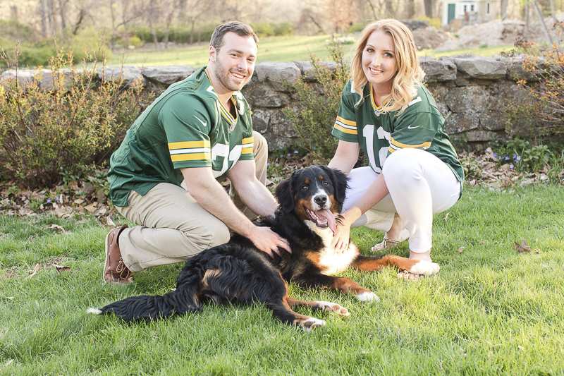couple wearing Packers jerseys and their dog, ©Jaye Kogut Photography, dog-friendly engagement session