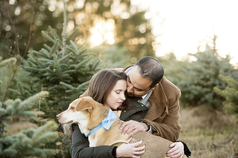 couple and their dog at Christmas tree farm, creative pet photography ideas | ©Julia Jane Studios,