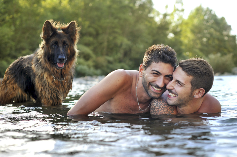 couple and dog in the river, engagement photos with dogs | ©Martina Campolo Photography