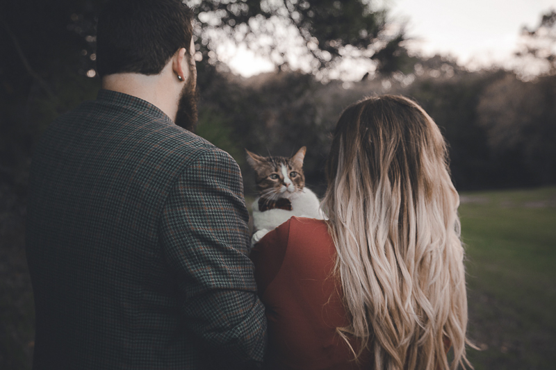 cat looking over woman's shoulder, ©Admyer Studios | cat-friendly engagement photos