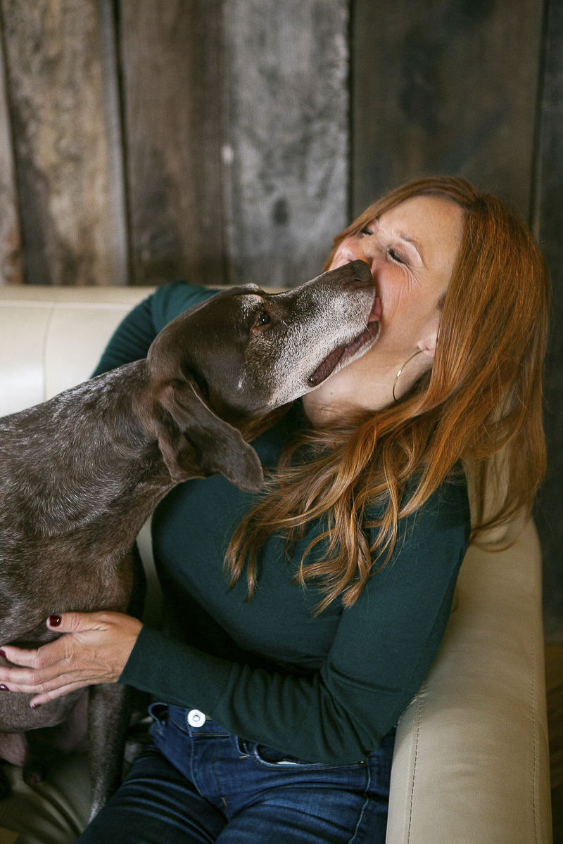 senior dog licking woman's face, bond between dogs and people, ©Mandy Whitley Photography 