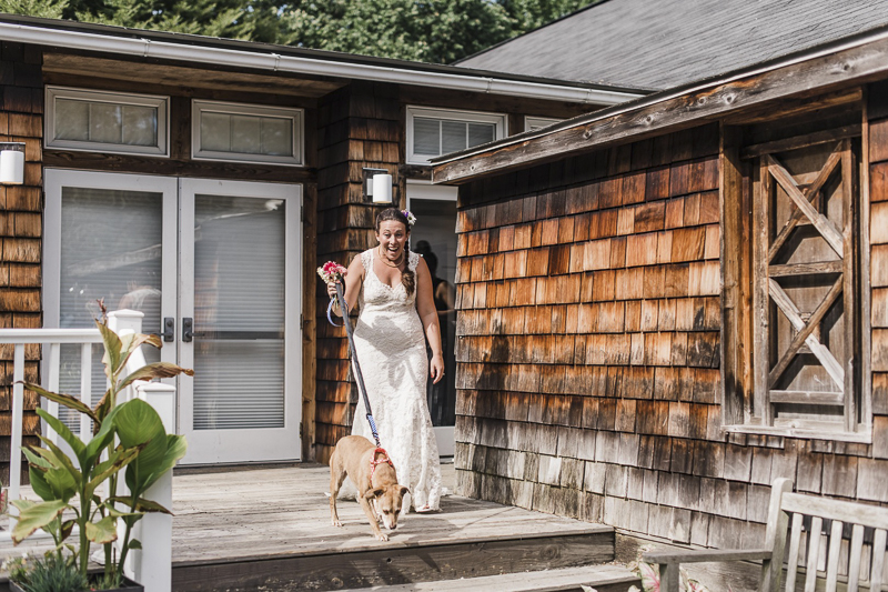 happy bride walking her dog | ©Landrum Photography | dog-friendly wedding