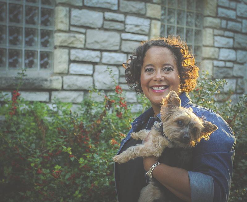 woman holding her Yorkie, golden hour photography | ©Aim With Mia Photography