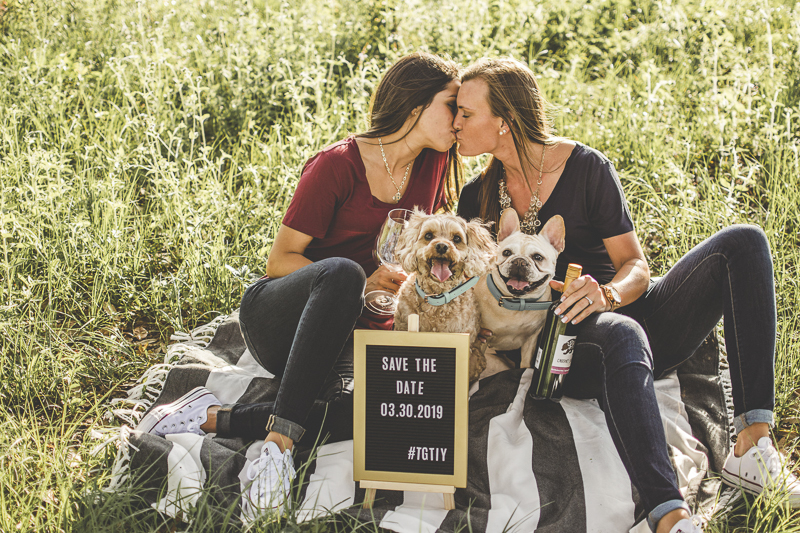same sex engagement celebration, Save The Date signs with dogs | ©Kimberly Santana Photography