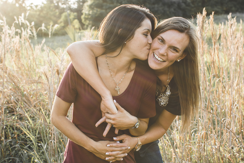 happy couple in tall grass,Central Florida engagement photography | ©Kimberly Santana Photography, LGBTQ engagement session