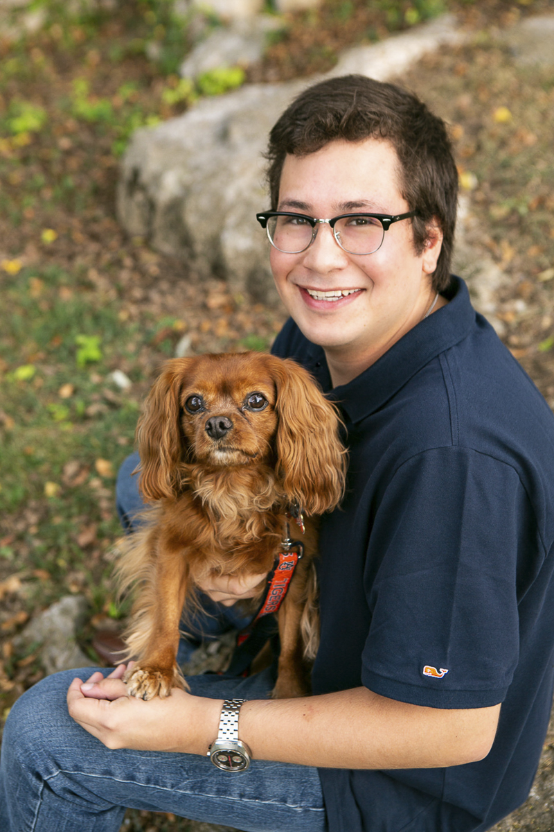 teen boy holding King Charles Cavalier rescue, ©Mandy Whitley Photography | dog photoshoot