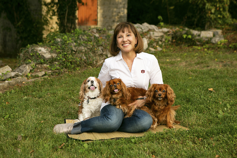 woman sitting on ground with Cavaliers | ©Mandy Whitley Photography | lifestyle dog portraits 