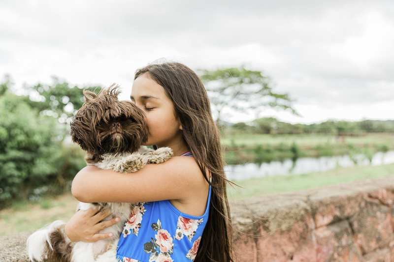 girl kissing her small dog, ©Storm Elaine Photography, O'ahu, Hawaii