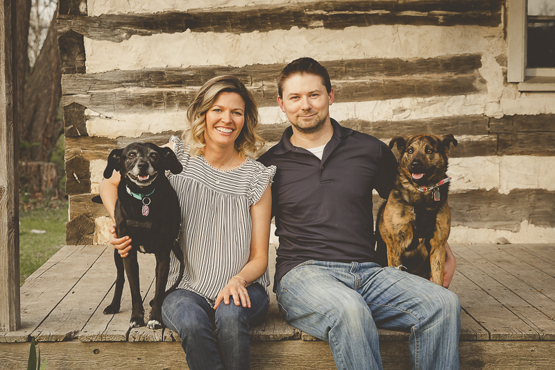 couple and their rescue dogs sitting on log cabin porch, ©Irish Eyes Photography | Lifestyle family and dog photographer, St Louis