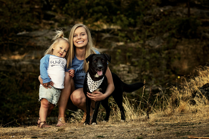 Spokane lifestyle family portraits with dogs, black mixed breed puppy wearing bandana, young mom and toddler girl, ©Noses and Toes Photography