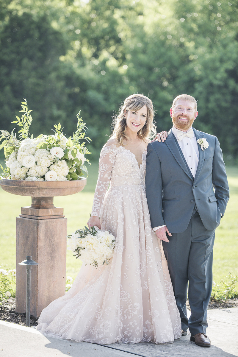 bride wearing blush dress, groom in steel blue tux | © epagaFOTO, Kansas City wedding photographer