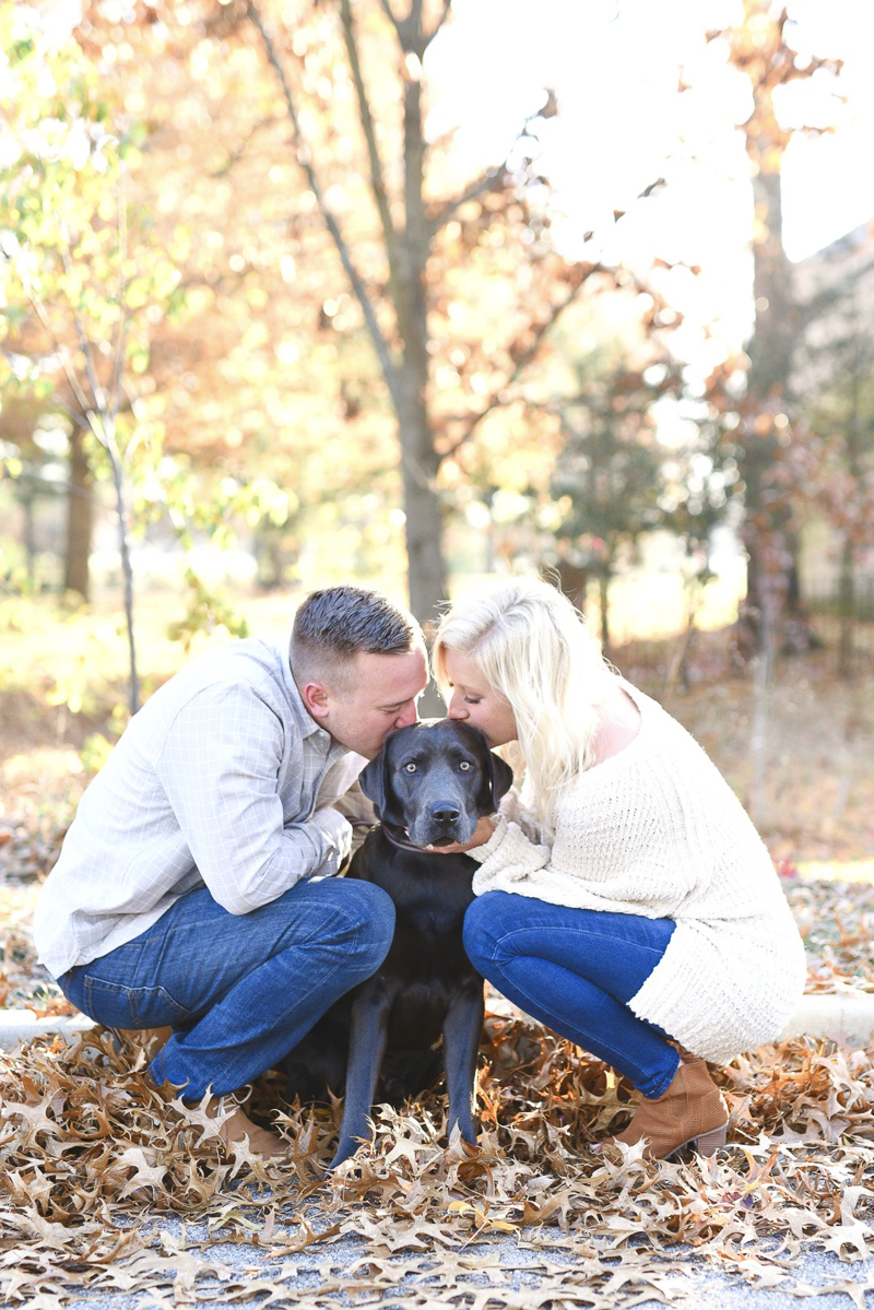 ©Jasmine Norris Photography couple kissing their dog's head, fall engagement portraits