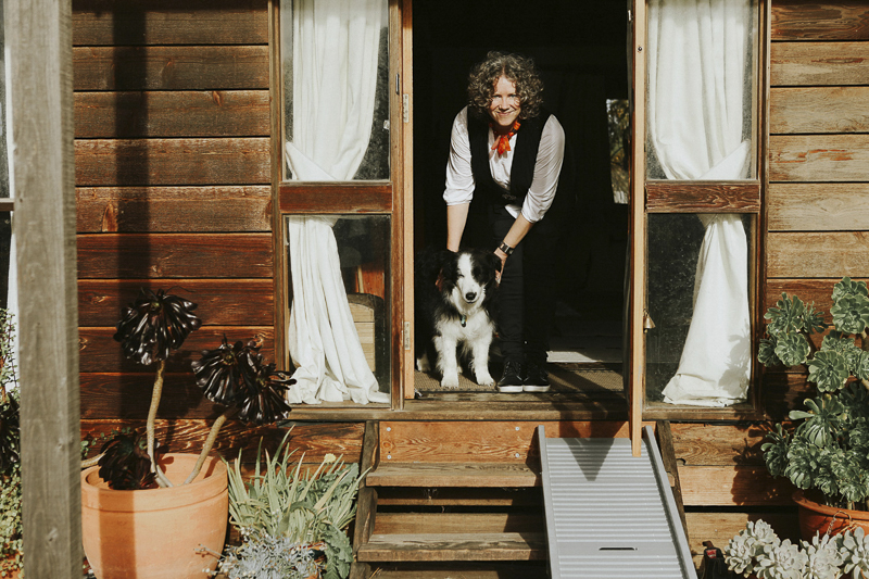 Melbourne in home pet photography, Border Collie and woman at doorway, steps and dog ramp | ©Dogfolk