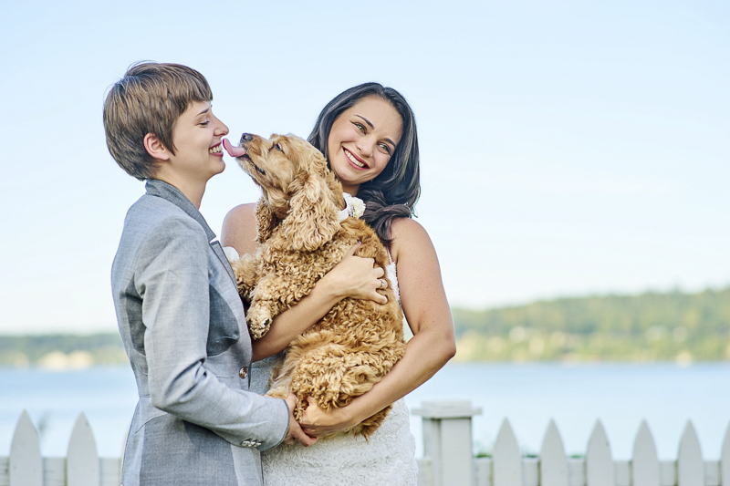 two brides and their dog, brides holding dog, English Cocker Spaniel