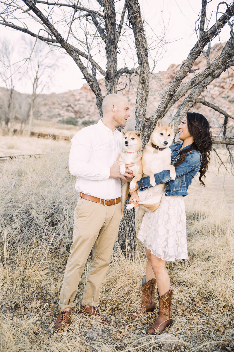 couple holding their Shiba Inus, engagement photos with dogs | ©Alycia Moore Photography