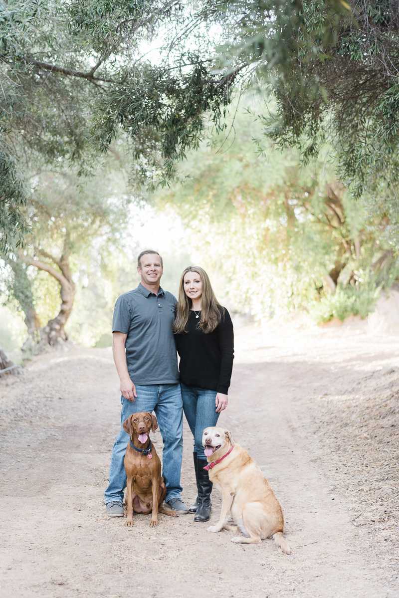 couple and their dogs on dirt road, Ojai Olive Oil, ©Jennifer Lourie Photograpy dog-friendly family portraits