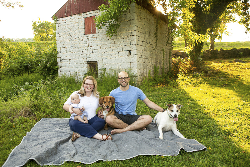 couple, baby, 2 dogs sitting on blanket | ©Mandy Whitley Photography, dog-friendly family photos Nashville 