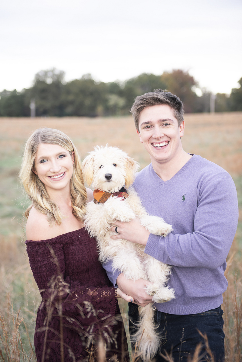 newlyweds holding their Goldendoodle puppy | ©Persuasion Photography | dog-friendly family photos, Memphis, TN