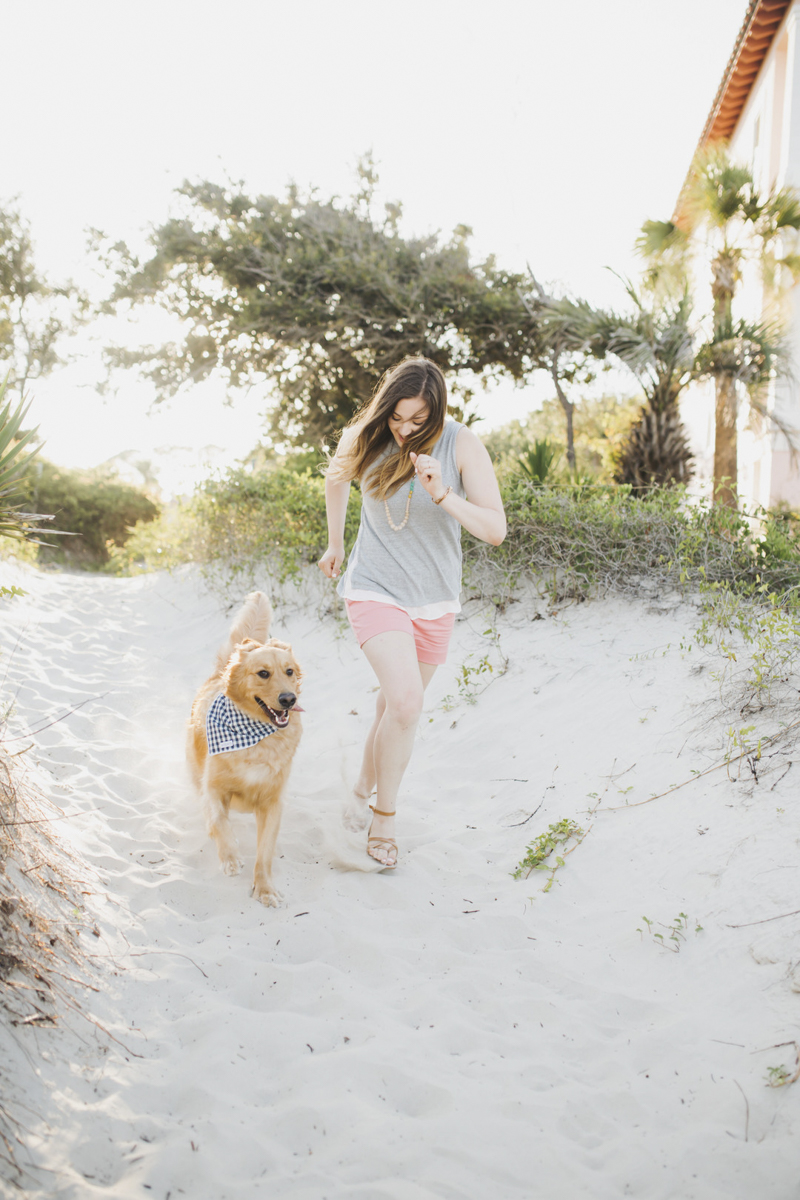 woman running with her dog on sandy beach, ©Rainey Gregg Photography | Golden Isles, GA