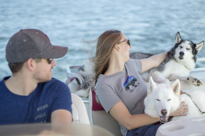 couple and their dogs on a boat, ©Salute Life Photography, Fort Drum, NY, lifestyle dog photography