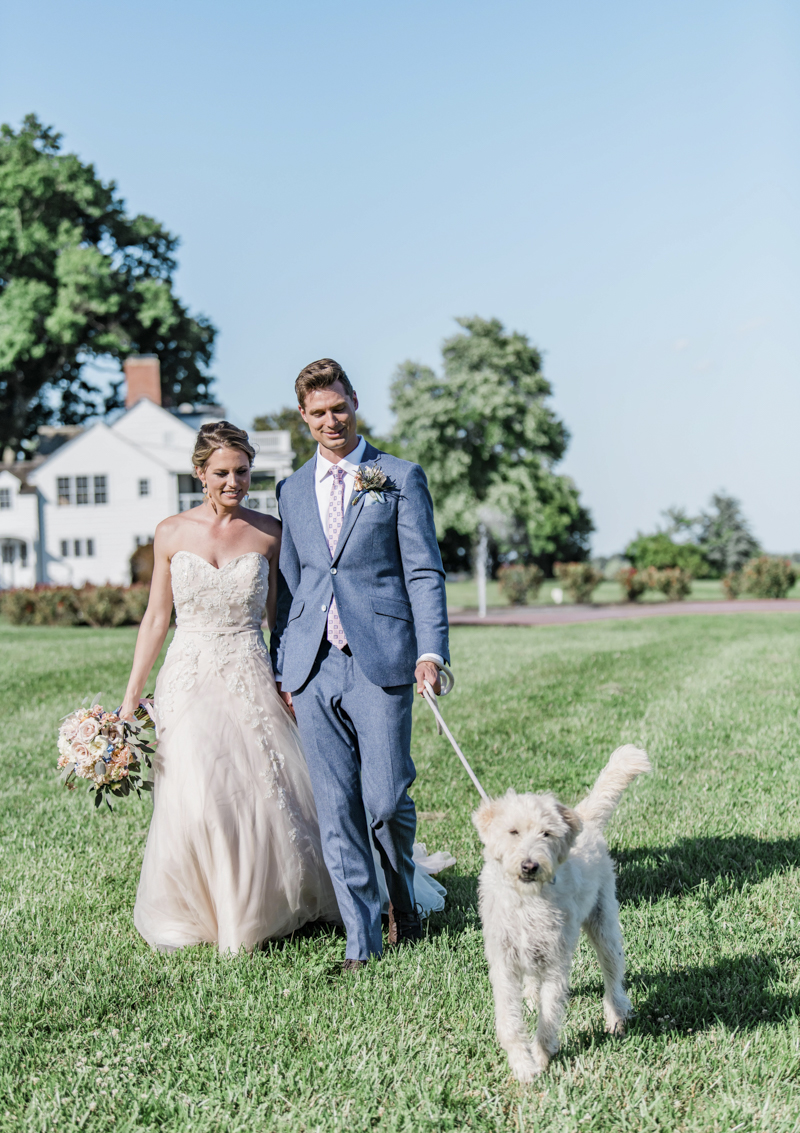 bride, groom and dog walking on grass, Patriotic Styled Shoot | ©Landrum Photography 