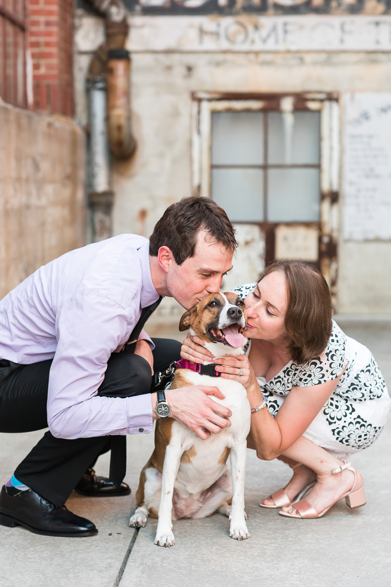 couple kissing cute mixed breed during engagement session © Michelle and Sara Photography 