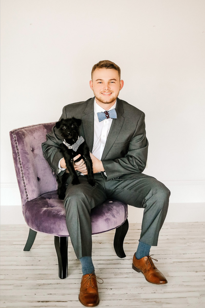 man wearing suit holding dog in bow tie, formal studio portraits with pets ©Samantha Coleman Photography | studio dog photography